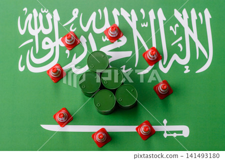 Metal barrels of oil, gas, or chemicals bearing on the flag of Saudi Arabia and a ban sign, embargo Metal barrels of oil, gas, or chemicals bearing on the flag of Saudi Arabia and a ban sign, embargo 141493180