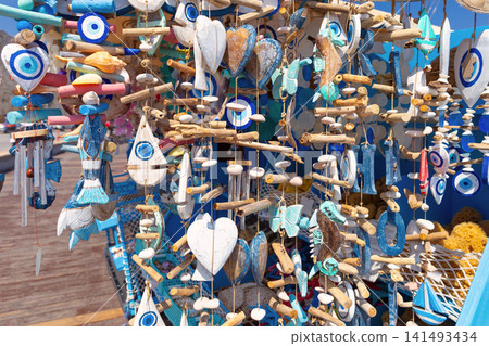 Traditional Greek Souvenirs with Evil Eye Charms at Market Stall in Rhodes, Greece Traditional Greek Souvenirs with Evil Eye Charms at Market Stall in Rhodes, Greece 141493434