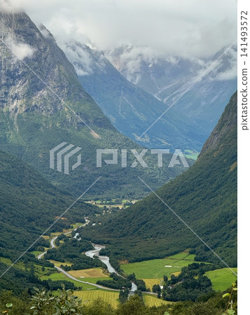 Peaceful countryside with natural beauty, tranquil scenery featuring rivers and distant mountains Peaceful countryside with natural beauty, tranquil scenery featuring rivers and distant mountains 141493572