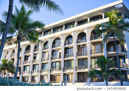 Curved Condo Building With Arched Balconies Among Palm Trees Curved Condo Building With Arched Balconies Among Palm Trees 141493660