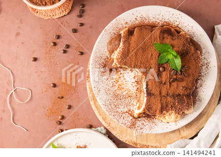 Top view of classic homemade Italian tiramisu cake Top view of classic homemade Italian tiramisu cake 141494241
