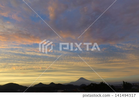 The silhouette of Mount Fuji against the twilight sky. The silhouette of Mount Fuji against the twilight sky. 141494317