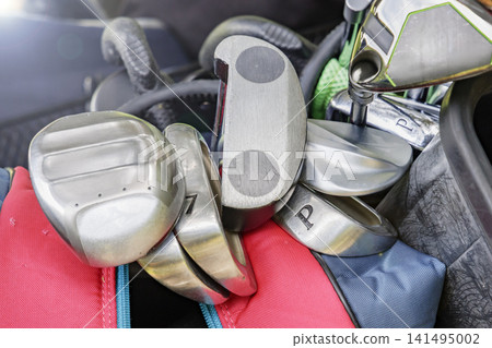 Golf clubs stored in a golf bag Golf clubs stored in a golf bag 141495002