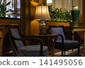 A tranquil space with stylish chairs and tables, reminiscent of a luxury hotel lounge. 141495056
