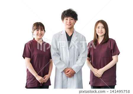 Doctors, nurses and other male and female staff wearing white coats and scrubs Doctors, nurses and other male and female staff wearing white coats and scrubs 141495758