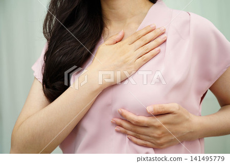 Asian woman self touching check lump or Breast cancer, Breast Self Exam. Asian woman self touching check lump or Breast cancer, Breast Self Exam. 141495779