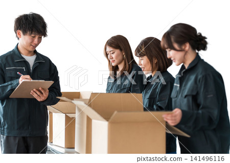 A worker of a transportation, logistics, courier, distribution, delivery, or delivery company packing packages into cardboard boxes A worker of a transportation, logistics, courier, distribution, delivery, or delivery company packing packages into cardboard boxes 141496116