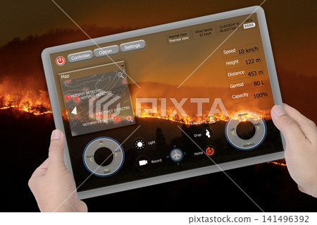 The screen interface of a drone controller used for fighting wildfires is in someone's hands. The screen interface of a drone controller used for fighting wildfires is in someone's hands. 141496392