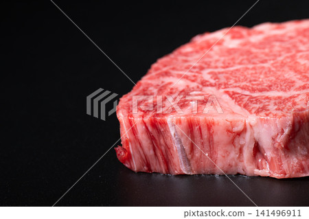 Beef against a black background Beef against a black background 141496911