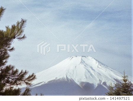 Lake Yamanaka, Yamanashi Prefecture, Mount Fuji in February under a light cloud cover. 141497521