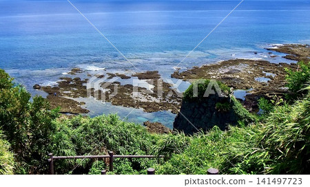 A view of the coral reef sea from a hilltop on Kumejima Island in Okinawa Prefecture. A view of the coral reef sea from a hilltop on Kumejima Island in Okinawa Prefecture. 141497723