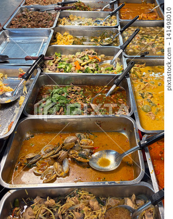 Many menu of Thai food on the stainless trays ready for sale in the morning market in Thailand Many menu of Thai food on the stainless trays ready for sale in the morning market in Thailand 141498010