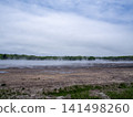 A river flowing through a wetland 141498260