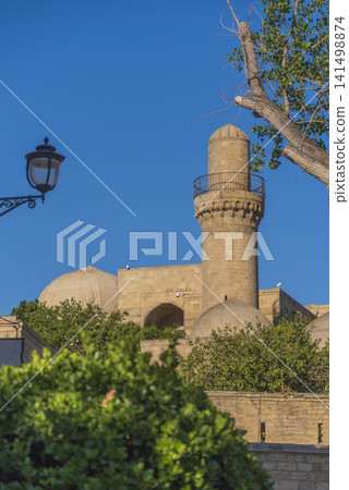 Vertical view of Shirvanshah palace minaret with street lantern and copy space Vertical view of Shirvanshah palace minaret with street lantern and copy space 141498874