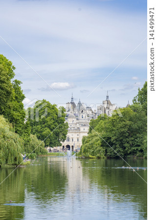 London's St. James's Park and its fountain, surrounded by blue skies and lush greenery. London's St. James's Park and its fountain, surrounded by blue skies and lush greenery. 141499471