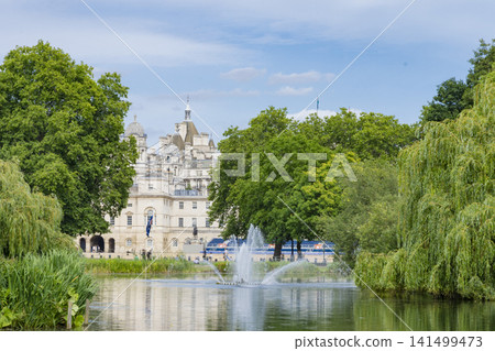 London's St. James's Park and its fountain, surrounded by blue skies and lush greenery. London's St. James's Park and its fountain, surrounded by blue skies and lush greenery. 141499473