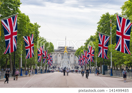 The Mall, a major London avenue, flies the British flag (Union Jack). The Mall, a major London avenue, flies the British flag (Union Jack). 141499485