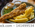Fish and chips, a traditional British dish. 141499534