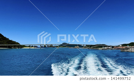 The Aka Bridge and the blue sea as seen from the high-speed ferry. The Aka Bridge and the blue sea as seen from the high-speed ferry. 141499752