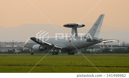 A Japan Air Self-Defense Force E-767 early warning and control aircraft takes off at dusk. A Japan Air Self-Defense Force E-767 early warning and control aircraft takes off at dusk. 141499982