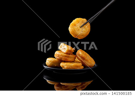 deep fried lotus root slices stuffed with savory meat filling 141500185