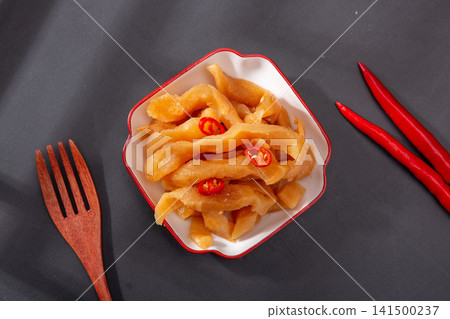 traditional pickled radish strips seasoned with spicy chili slices traditional pickled radish strips seasoned with spicy chili slices 141500237