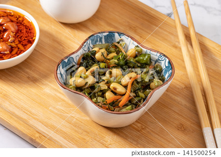 salted potherb mustard greens mixed with soybeans and carrot strips 141500254