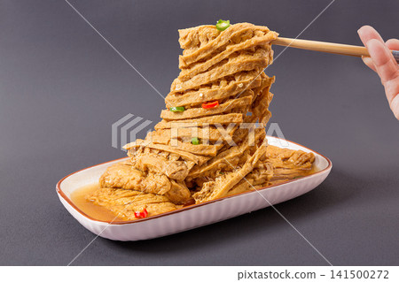 braised sliced dried tofu blocks with cut textured pattern savory braised sliced dried tofu blocks with cut textured pattern savory 141500272