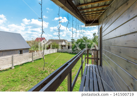 Country House Balcony View Overlooking Yard and Neighboring Houses Country House Balcony View Overlooking Yard and Neighboring Houses 141500719