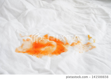 Dirty tomato sauce stain removal or ketchup on cloth accident to wash with washing powder, cleaning housework. 141500838