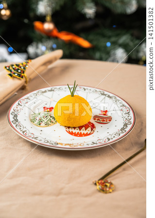 Healthy New Year mochi dessert shaped like orange in festive plate low calorie dairy lactose vegetarian natural ingredients holiday background 141501382
