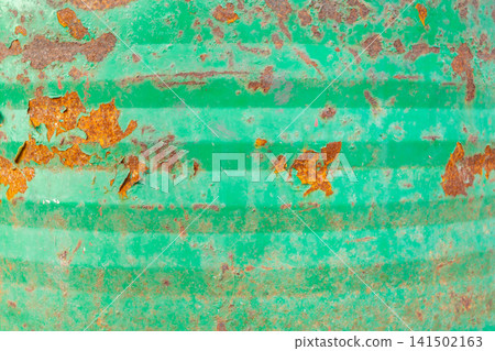 Weathered green metal surface peeling paint rust creating distressed industrial texture suitable for backgrounds design overlays aged material themes 141502163