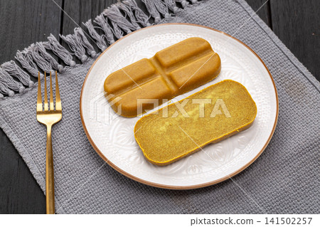 japanese curry roux blocks, solid curry paste cubes for making traditional Asian savory stew, aromatic culinary ingredient. japanese curry roux blocks, solid curry paste cubes for making traditional Asian savory stew, aromatic culinary ingredient. 141502257
