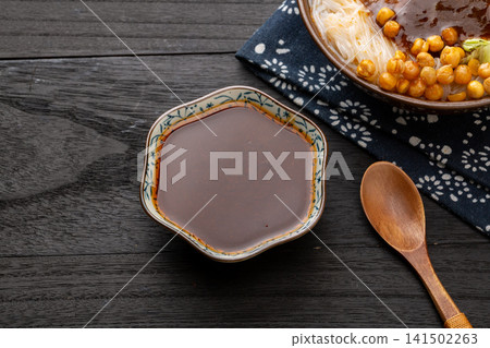 spicy Korean buldak sauce, hot chili oil paste for fire chicken noodles, fiery intense Asian culinary condiment. spicy Korean buldak sauce, hot chili oil paste for fire chicken noodles, fiery intense Asian culinary condiment. 141502263