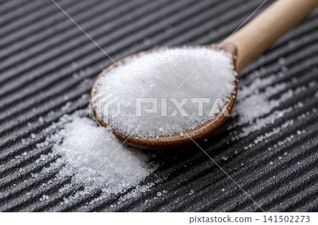 macro texture of refined sea salt crystals, pure white mineral sodium granules for gourmet culinary seasoning. macro texture of refined sea salt crystals, pure white mineral sodium granules for gourmet culinary seasoning. 141502273