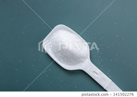 macro texture of refined sea salt crystals, pure white mineral sodium granules for gourmet culinary seasoning. macro texture of refined sea salt crystals, pure white mineral sodium granules for gourmet culinary seasoning. 141502276