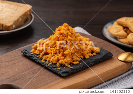 traditional golden pork floss, dehydrated savory shredded meat wool, authentic Asian bakery and porridge topping. traditional golden pork floss, dehydrated savory shredded meat wool, authentic Asian bakery and porridge topping. 141502310