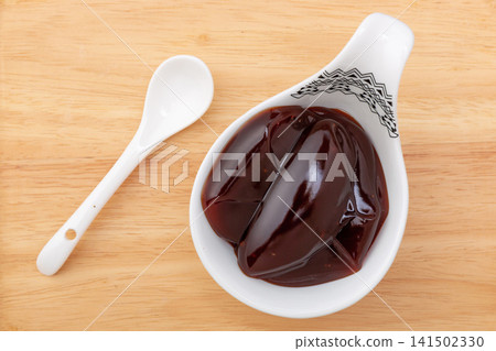 thick Cantonese char siu sauce, sweet and savory dark red Chinese BBQ marinade for roasting meat. thick Cantonese char siu sauce, sweet and savory dark red Chinese BBQ marinade for roasting meat. 141502330