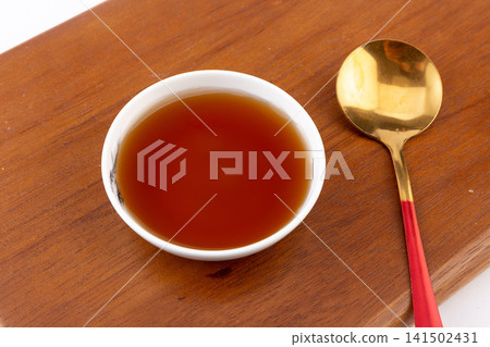 clear amber fish sauce traditional fermented condiment for Southeast Asian cuisine clear amber fish sauce traditional fermented condiment for Southeast Asian cuisine 141502431