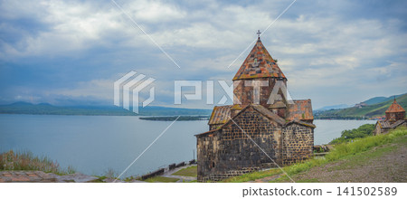 Ancient Sevanavank monastery against Lake Sevan in Armenia with copy space Ancient Sevanavank monastery against Lake Sevan in Armenia with copy space 141502589