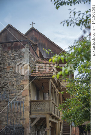 Traditional carved wooden balconies of an ancient monastery in Armenia with copy space Traditional carved wooden balconies of an ancient monastery in Armenia with copy space 141502592