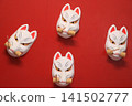 White fox on a red background 141502777
