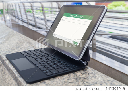 Tablet with email message application on keyboard case, digital communication and mobile technology Tablet with email message application on keyboard case, digital communication and mobile technology 141503049