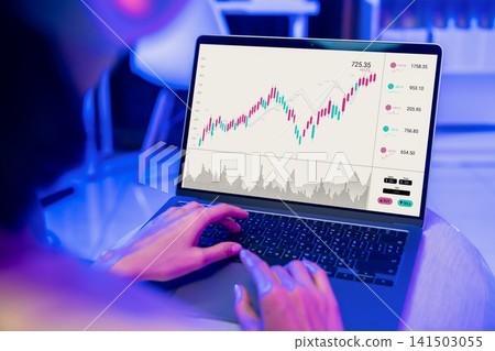 Person analyzing stock market chart on laptop computer, online trading and financial investment. Person analyzing stock market chart on laptop computer, online trading and financial investment. 141503055