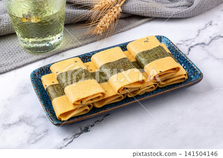 crispy egg roll pastry wrapped with seaweed nori 141504146