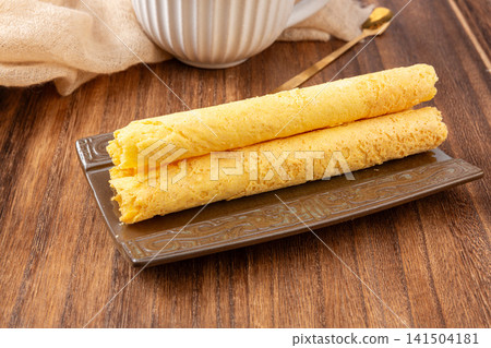 crispy golden brown egg roll biscuits sweet pastry 141504181