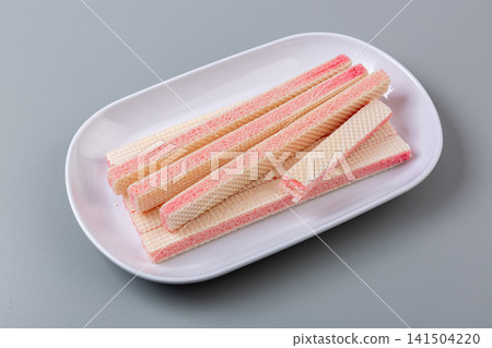 pwafer biscuits, strawberry cheese, layered wafers, pink cream, fruit flavor, crispy texture, rectangular strips, crunchy cookies, sweet pastry, confectionery, afternoon tea, tea snack, dessert pwafer biscuits, strawberry cheese, layered wafers, pink cream, fruit flavor, crispy texture, rectangular strips, crunchy cookies, sweet pastry, confectionery, afternoon tea, tea snack, dessert 141504220