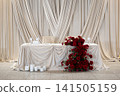 Elegant wedding reception table decorated with red roses and white candles  141505159