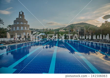 Bodrum, Turkey -June 4 2026: Selectum collection Bodrum is a 5 star all inclusive resort located in Akyarlar Turkey . Picture showing the prominent tower structure at the main pool area, Daylight shot 141506063
