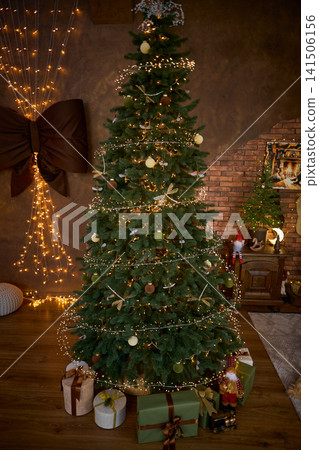 Fully Decorated Christmas Tree with Wrapped Gifts and Fairy Lights Fully Decorated Christmas Tree with Wrapped Gifts and Fairy Lights 141506156